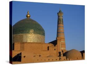 Minaret and Tiled Dome of a Mosque Rise Above the Old City of Khiva-Antonia Tozer-Stretched Canvas