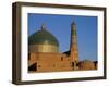 Minaret and Tiled Dome of a Mosque Rise Above the Old City of Khiva-Antonia Tozer-Framed Photographic Print