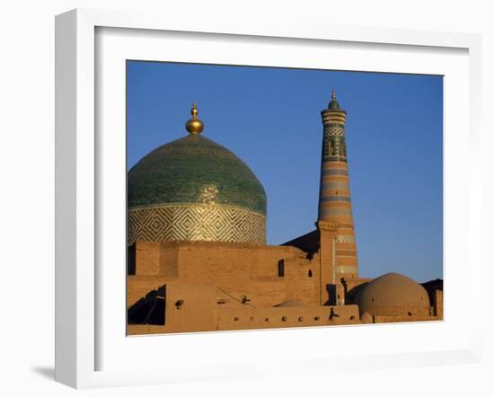 Minaret and Tiled Dome of a Mosque Rise Above the Old City of Khiva-Antonia Tozer-Framed Photographic Print