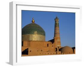 Minaret and Tiled Dome of a Mosque Rise Above the Old City of Khiva-Antonia Tozer-Framed Photographic Print