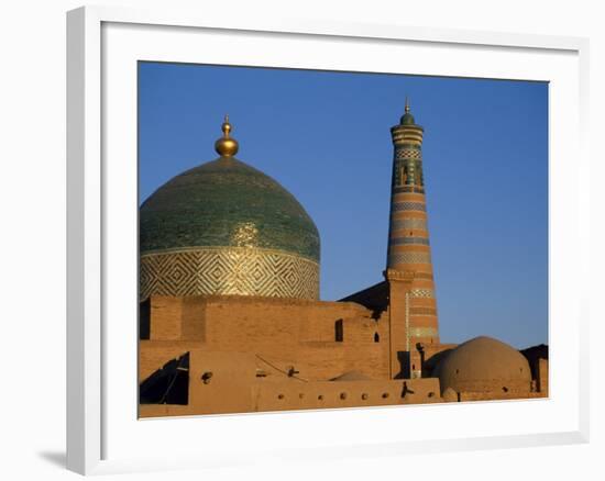 Minaret and Tiled Dome of a Mosque Rise Above the Old City of Khiva-Antonia Tozer-Framed Photographic Print