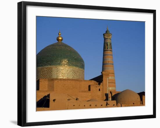 Minaret and Tiled Dome of a Mosque Rise Above the Old City of Khiva-Antonia Tozer-Framed Photographic Print