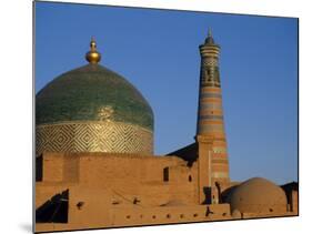 Minaret and Tiled Dome of a Mosque Rise Above the Old City of Khiva-Antonia Tozer-Mounted Photographic Print