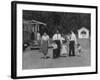 Miner Maurice Ruddick with Family and Friends Walking Near Segregated Camp Site-Carl Mydans-Framed Photographic Print