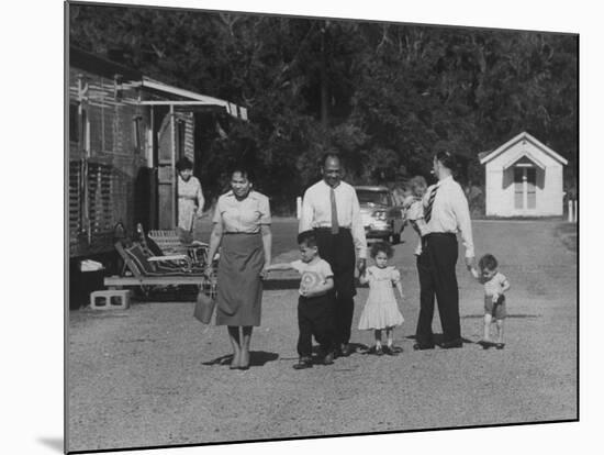 Miner Maurice Ruddick with Family and Friends Walking Near Segregated Camp Site-Carl Mydans-Mounted Photographic Print