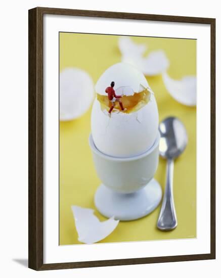 Miniature Footballer Taking the Lid off a Boiled Egg-Martina Schindler-Framed Photographic Print