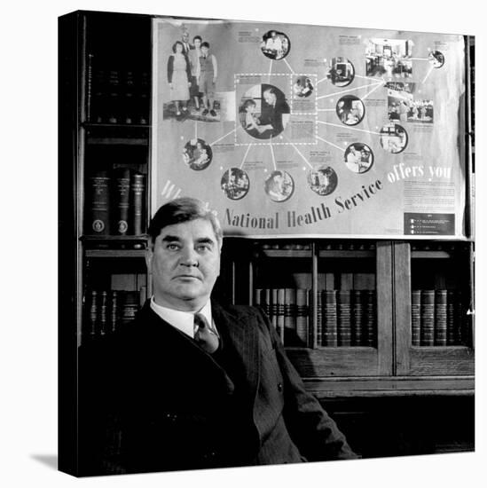 Minister of Health Aneurin Bevan, Sitting Beneath "National Health Service" Poster-null-Stretched Canvas