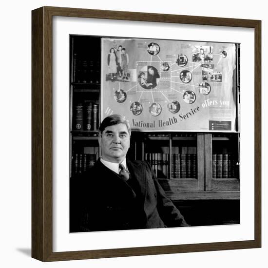 Minister of Health Aneurin Bevan, Sitting Beneath "National Health Service" Poster-null-Framed Photographic Print