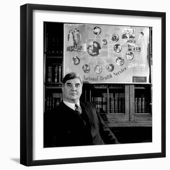 Minister of Health Aneurin Bevan, Sitting Beneath "National Health Service" Poster-null-Framed Photographic Print