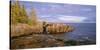 Minnesota, Lichen Covered Rocks and Stormy Sky over Lake Superior at Artist Point-John Barger-Stretched Canvas