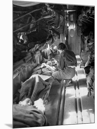 Miss Mary Smith of South Carolina Treating Patients During Flight to North-American Photographer-Mounted Photographic Print