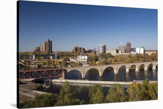 Mississippi River and City Skyline, Minneapolis, Minnesota, USA-Walter Bibikow-Stretched Canvas