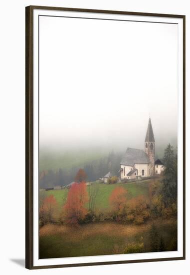 Mist and colourful trees surround the alpine church in the fall, St. Magdalena, Funes Valley, South-Roberto Moiola-Framed Premium Photographic Print