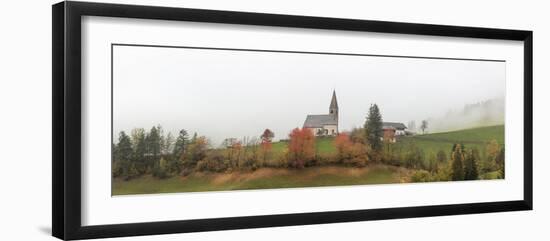 Mist and colourful trees surround the alpine church in the fall, St. Magdalena, Funes Valley, South-Roberto Moiola-Framed Photographic Print
