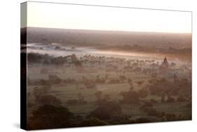 Mists from the Nearby Irrawaddy River Floating across Bagan (Pagan), Myanmar (Burma)-Annie Owen-Stretched Canvas