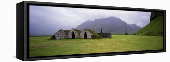 Misty Mountain Landscape with Stone Huts, Iceland-null-Framed Stretched Canvas