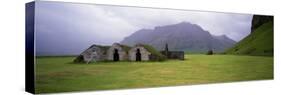 Misty Mountain Landscape with Stone Huts, Iceland-null-Stretched Canvas