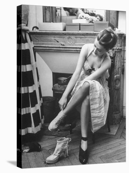 Model Changing Her Shoes For Pierre Balmain's Fashion Show-Nina Leen-Stretched Canvas