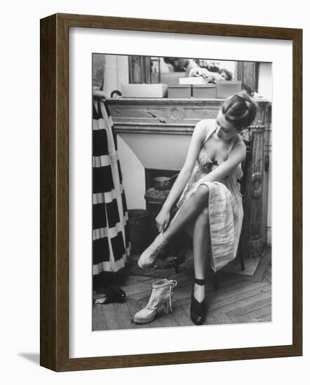 Model Changing Her Shoes For Pierre Balmain's Fashion Show-Nina Leen-Framed Photographic Print