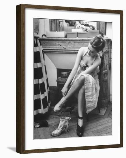 Model Changing Her Shoes For Pierre Balmain's Fashion Show-Nina Leen-Framed Photographic Print