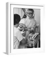 Model Getting a Manicure Prior to the "April in Paris" Charity Ball-Yale Joel-Framed Photographic Print