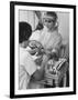 Model Getting a Manicure Prior to the "April in Paris" Charity Ball-Yale Joel-Framed Photographic Print