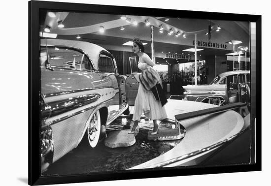 Model Gingerly Traversing Stepping Stones to Get to La Parisienne Pontiac Hard Top Car on Display-Walter Sanders-Framed Photographic Print