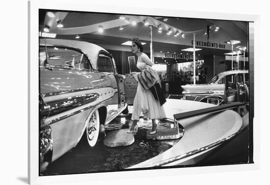 Model Gingerly Traversing Stepping Stones to Get to La Parisienne Pontiac Hard Top Car on Display-Walter Sanders-Framed Premium Photographic Print