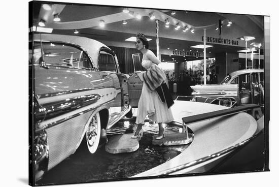 Model Gingerly Traversing Stepping Stones to Get to La Parisienne Pontiac Hard Top Car on Display-Walter Sanders-Stretched Canvas