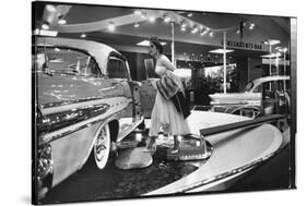 Model Gingerly Traversing Stepping Stones to Get to La Parisienne Pontiac Hard Top Car on Display-Walter Sanders-Stretched Canvas