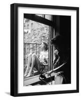 Model Jean Patchet Seated on a Fire Escape, Talks with Eileen Ford, New York, NY, 1948-Nina Leen-Framed Photographic Print