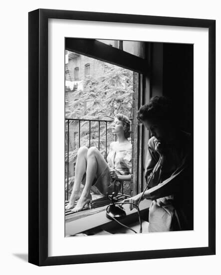 Model Jean Patchet Seated on a Fire Escape, Talks with Eileen Ford, New York, NY, 1948-Nina Leen-Framed Photographic Print