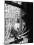 Model Jean Patchet Seated on a Fire Escape, Talks with Eileen Ford, New York, NY, 1948-Nina Leen-Mounted Photographic Print