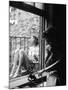Model Jean Patchet Seated on a Fire Escape, Talks with Eileen Ford, New York, NY, 1948-Nina Leen-Mounted Photographic Print