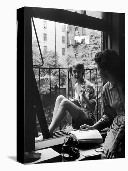 Model Jean Patchet Seated on a Fire Escape, Talks with Eileen Ford, New York, NY, 1948-Nina Leen-Stretched Canvas