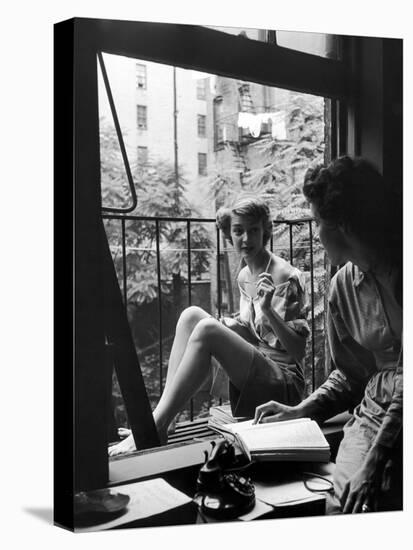 Model Jean Patchet Seated on a Fire Escape, Talks with Eileen Ford, New York, NY, 1948-Nina Leen-Stretched Canvas