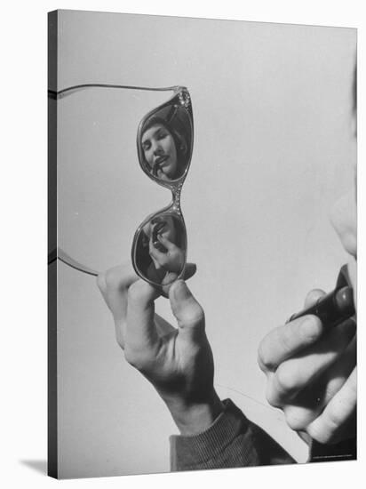 Model Lilly Fernandez Using Sunglasses as a Mirror-Martha Holmes-Stretched Canvas
