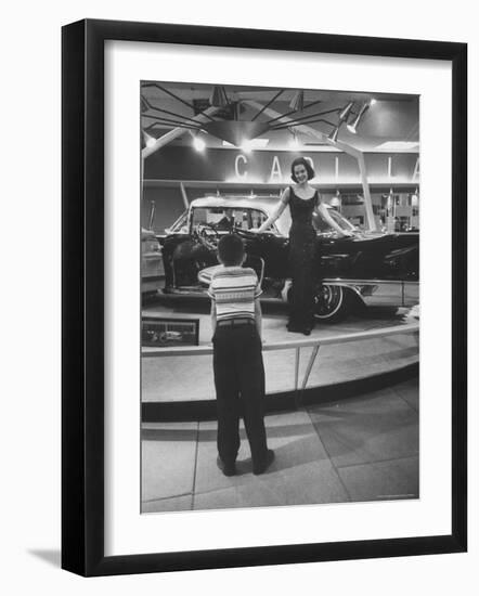 Model Posing Beside Cadillac Eldorado Captures Attention of Young Boy at National Automobile Show-Walter Sanders-Framed Photographic Print