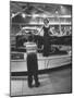 Model Posing Beside Cadillac Eldorado Captures Attention of Young Boy at National Automobile Show-Walter Sanders-Mounted Photographic Print