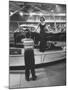 Model Posing Beside Cadillac Eldorado Captures Attention of Young Boy at National Automobile Show-Walter Sanders-Mounted Photographic Print