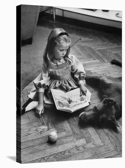 Model Posing with Book and Pet Dog-Nina Leen-Stretched Canvas