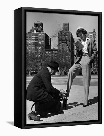 Model Showing Off Slacks as She Reads a First Aid Text Book in Washington Square Park-Nina Leen-Framed Stretched Canvas