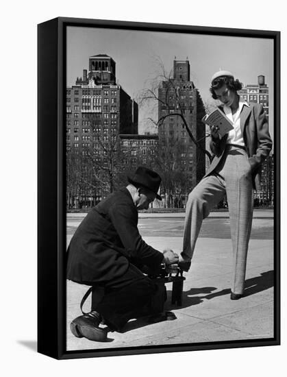 Model Showing Off Slacks as She Reads a First Aid Text Book in Washington Square Park-Nina Leen-Framed Stretched Canvas