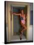 Model Standing in Doorway Modeling Ralph Lauren's Cotton and Lycra One Piece Flag Bathing Suit-Ted Thai-Stretched Canvas