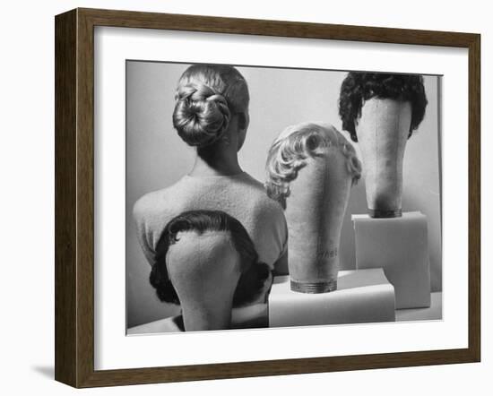 Model Vikki Dougan Wearing Attachable Bun of Extra Hair, Next to Other Wigs-Nina Leen-Framed Photographic Print