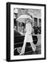 Model, Walking with an Umbrella by Givenchy-Kourken Pakchanian-Framed Premium Giclee Print