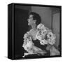 Model Wearing a Flowery Dress While Peering Into the Distance-Nina Leen-Framed Stretched Canvas
