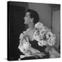 Model Wearing a Flowery Dress While Peering Into the Distance-Nina Leen-Stretched Canvas