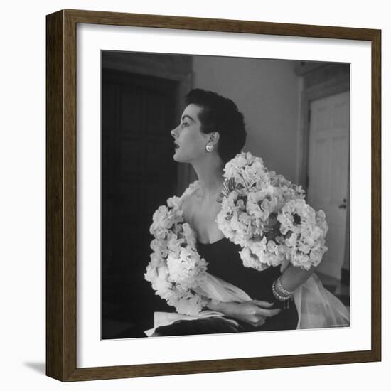 Model Wearing a Flowery Dress While Peering Into the Distance-Nina Leen-Framed Photographic Print