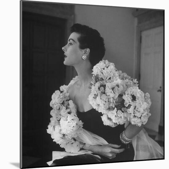 Model Wearing a Flowery Dress While Peering Into the Distance-Nina Leen-Mounted Photographic Print